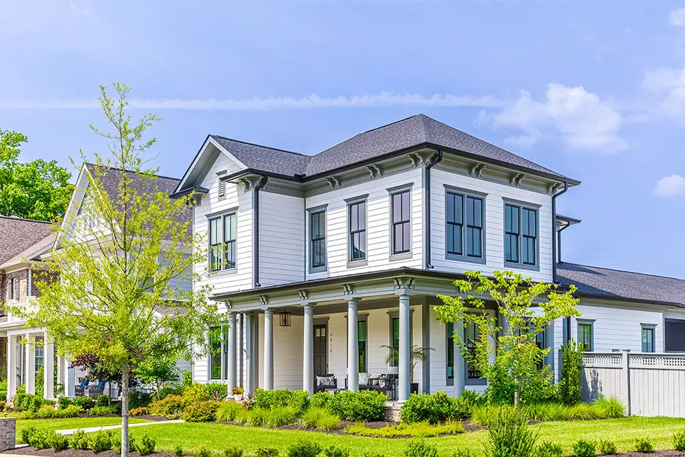 New home with front porch by SLC Homes